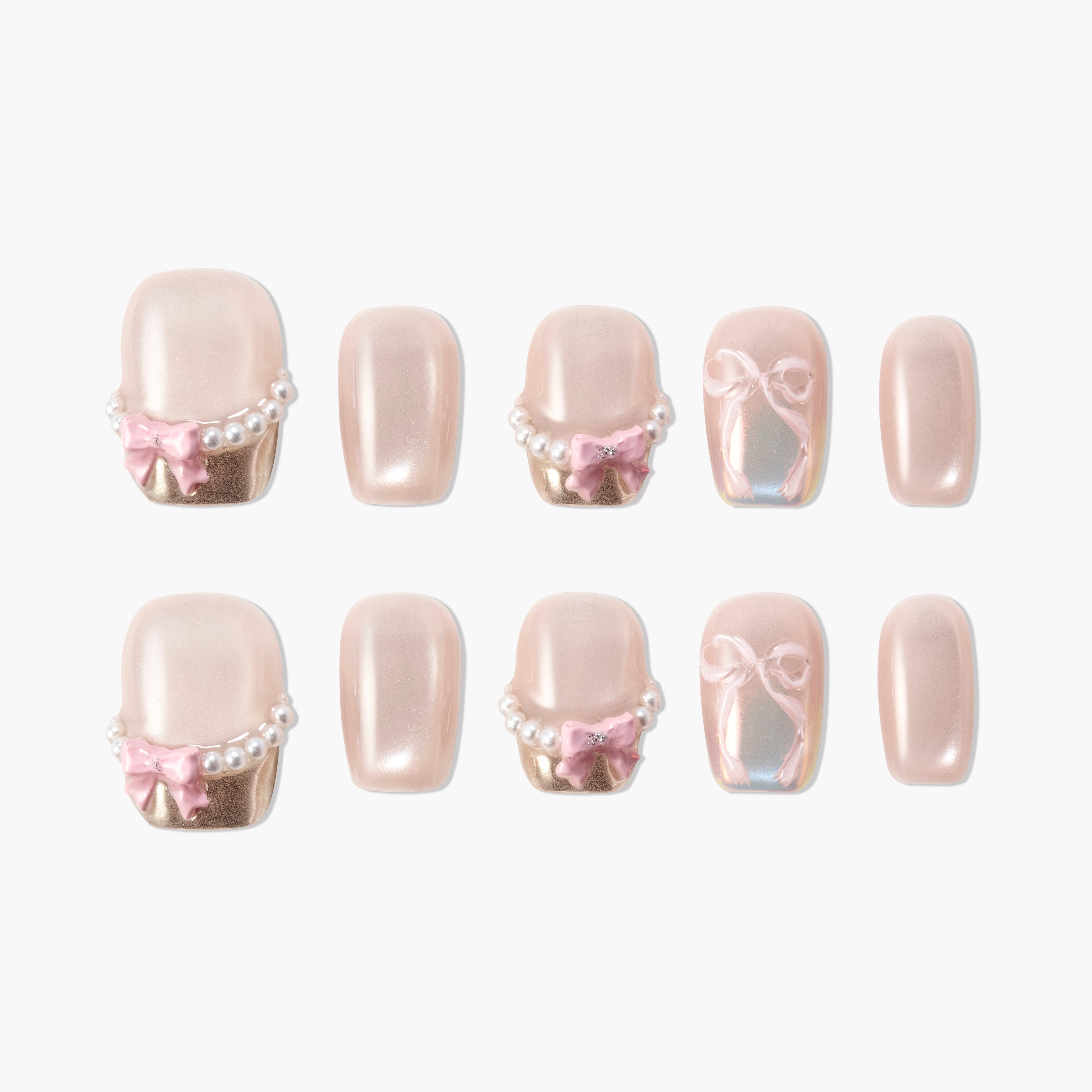 Set of nude pink fake nails with pearl and pink bow decorations and iridescent bow designs