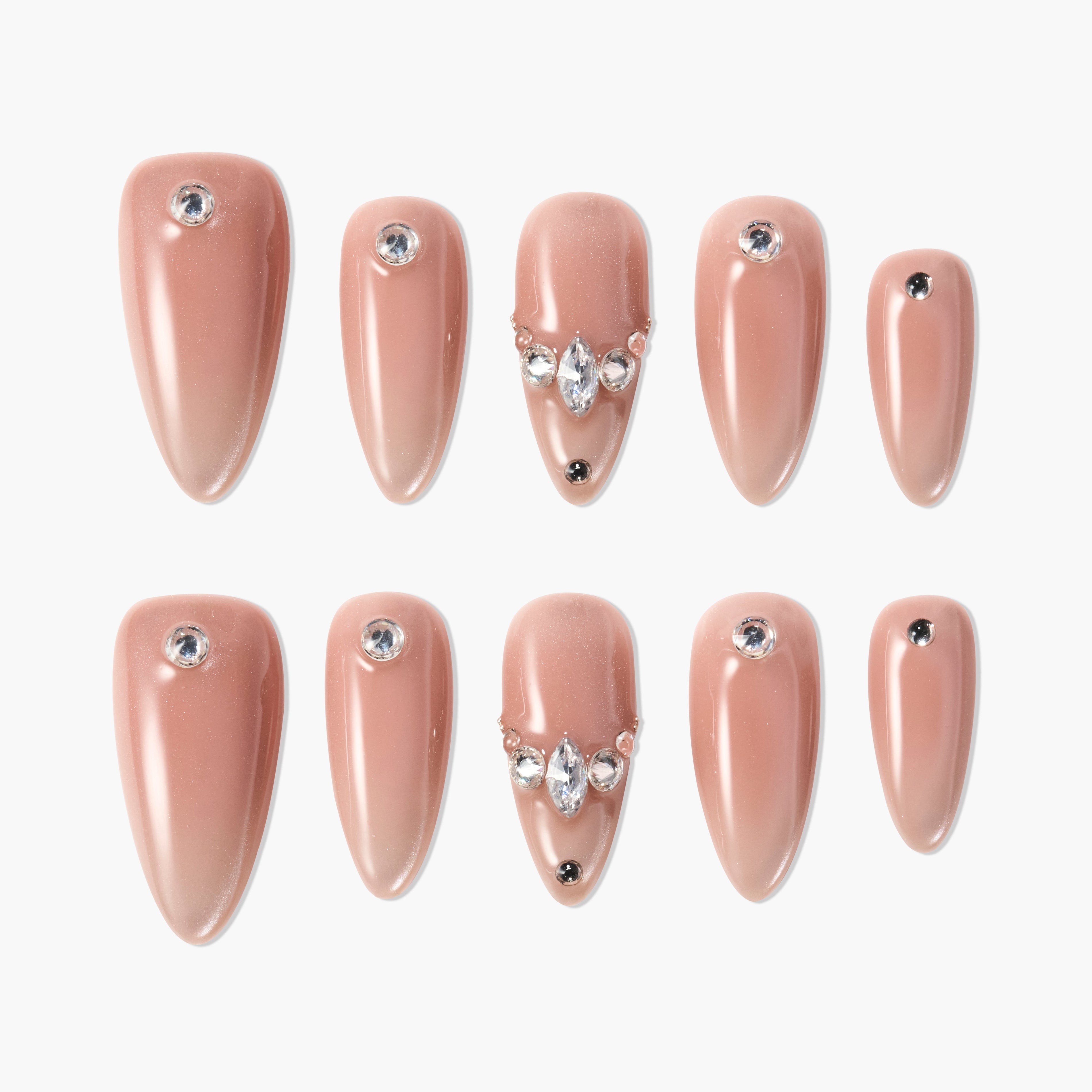 Set of nude beige glossy press-on nails with rhinestone accents in various sizes