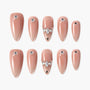 Set of nude beige glossy press-on nails with rhinestone accents in various sizes