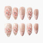 Pink and nude press-on nails with 3D floral accents and rhinestones, elegant nail art set