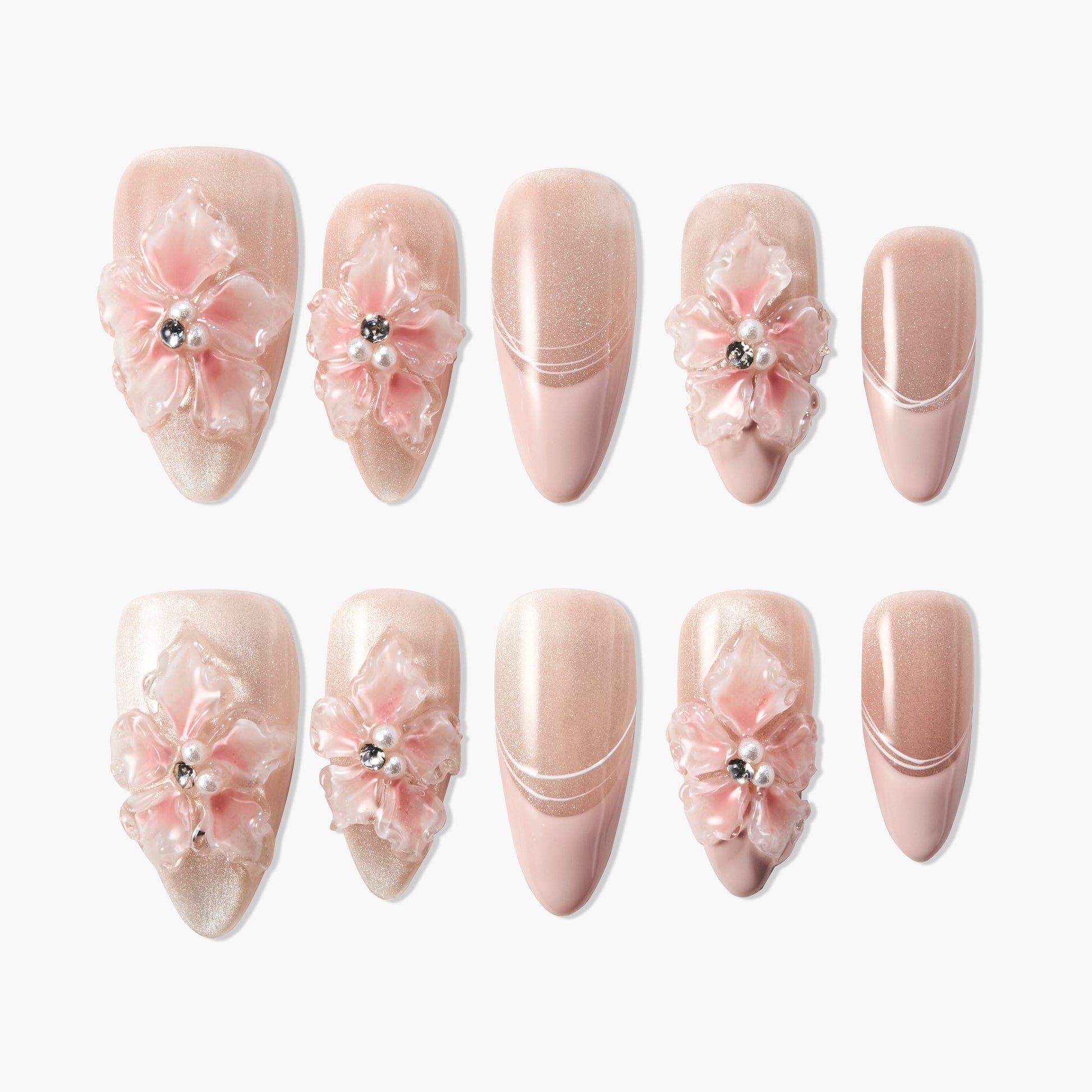 Pink and nude press-on nails with 3D floral accents and rhinestones, elegant nail art set