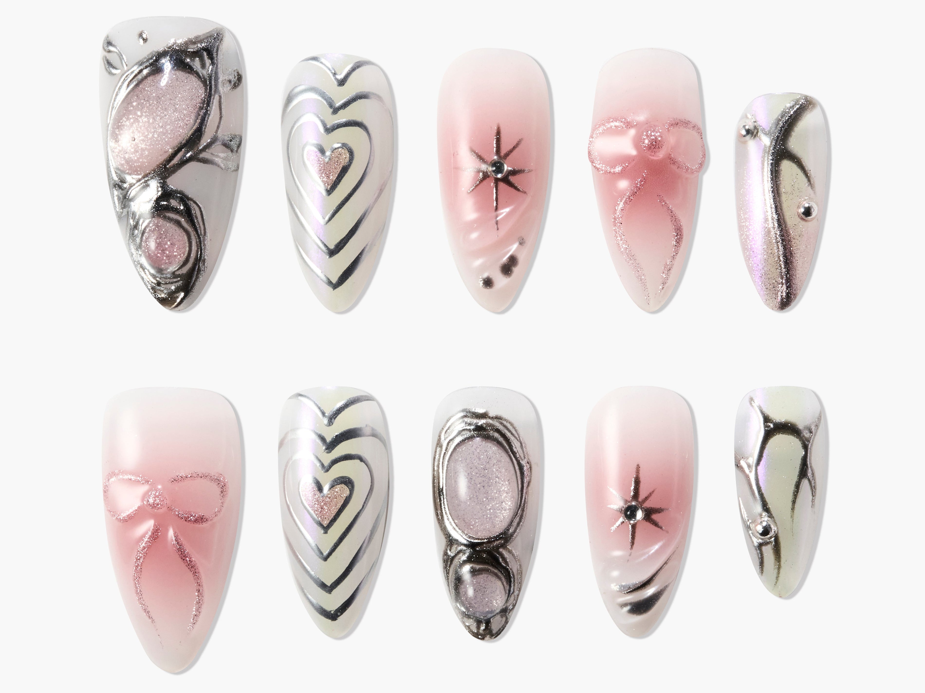 Handmade pink and silver press-on nails with hearts, bows, rhinestones, and abstract designs