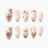 Set of pink and white press-on nails with panda and floral branch designs