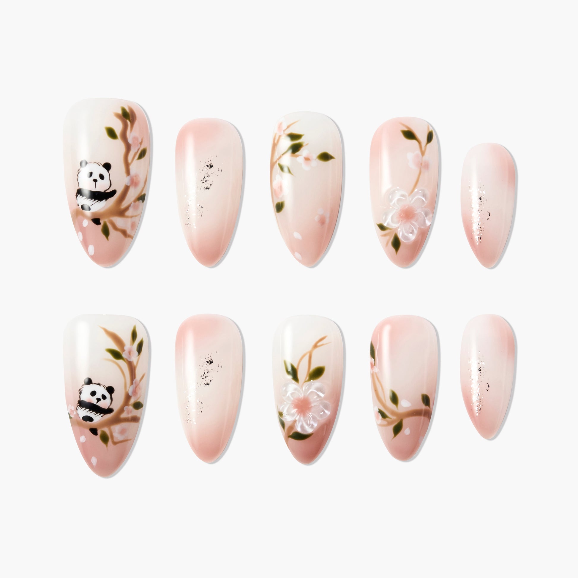 Set of pink and white press-on nails with panda and floral branch designs