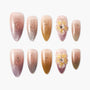 Set of glittery ombre false nails in pink and gold with flower 3D nail art design