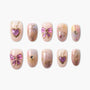 Set of 10 pastel pink and purple false nails with gold celestial and bow designs