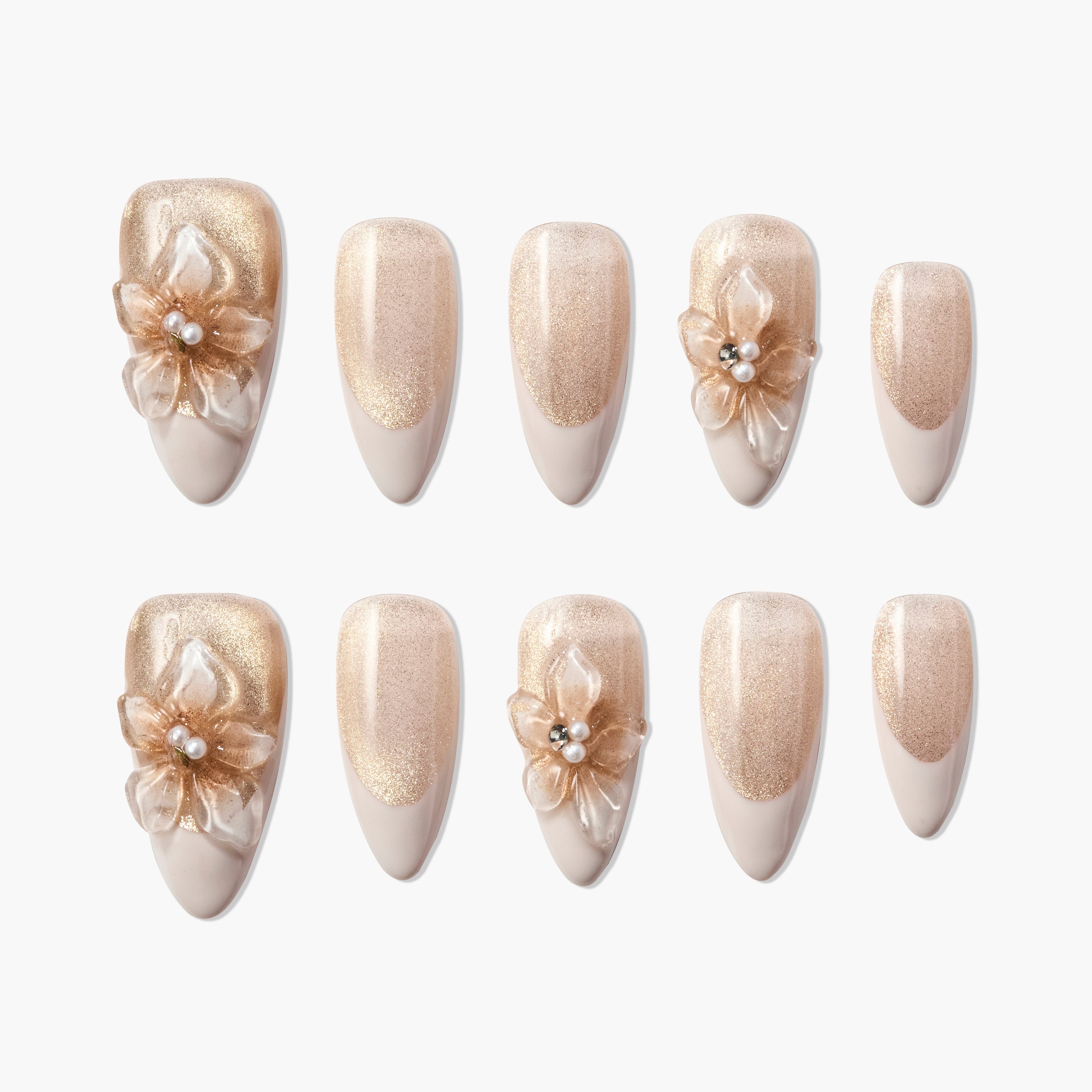 Set of glittery nude and gold artificial nails with 3D floral and pearl accents