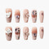 Set of nude pink artificial nails decorated with 3D white dogs, bows, heart and oval pink crystals