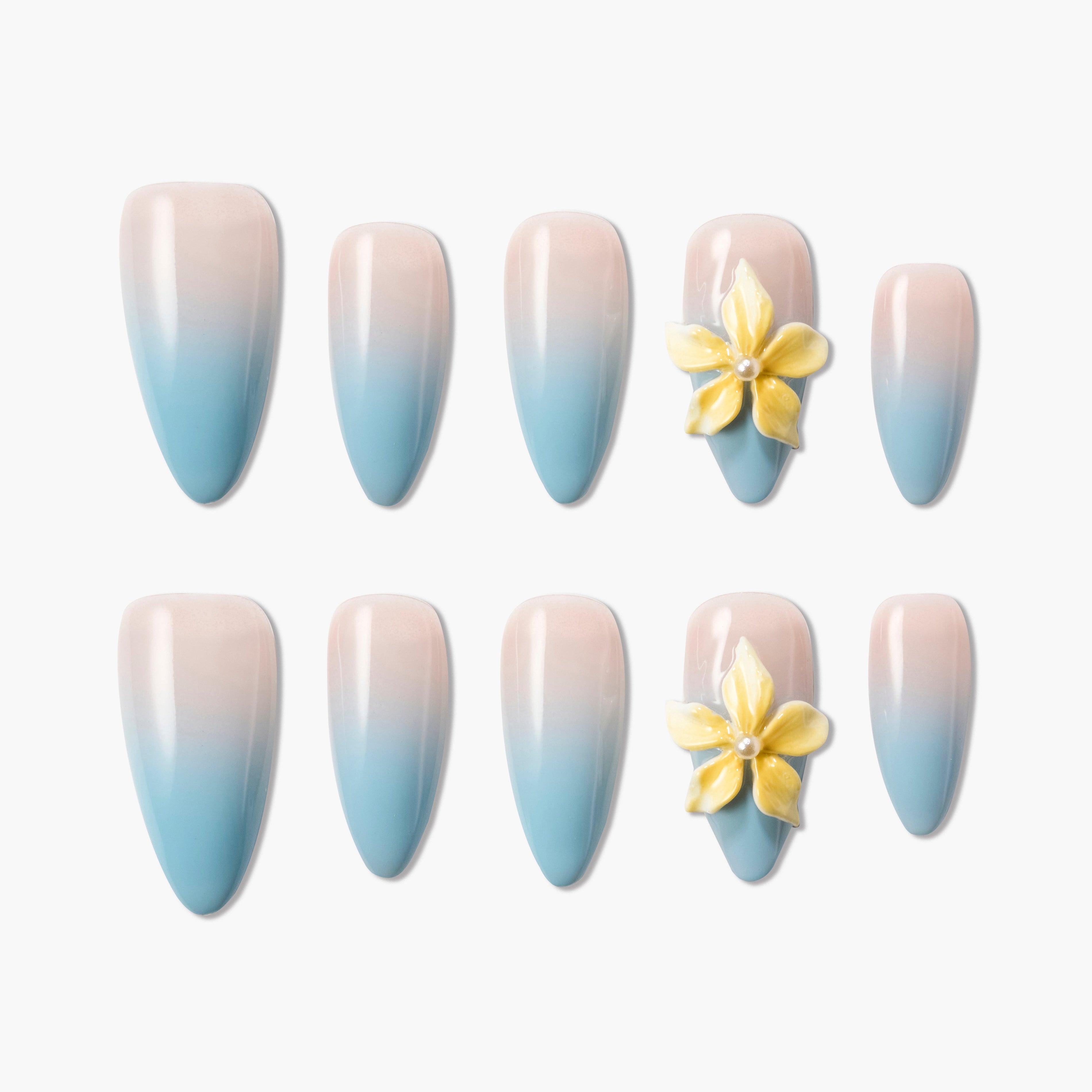 Set of blue and pink ombre press-on nails with yellow 3D flower embellishments