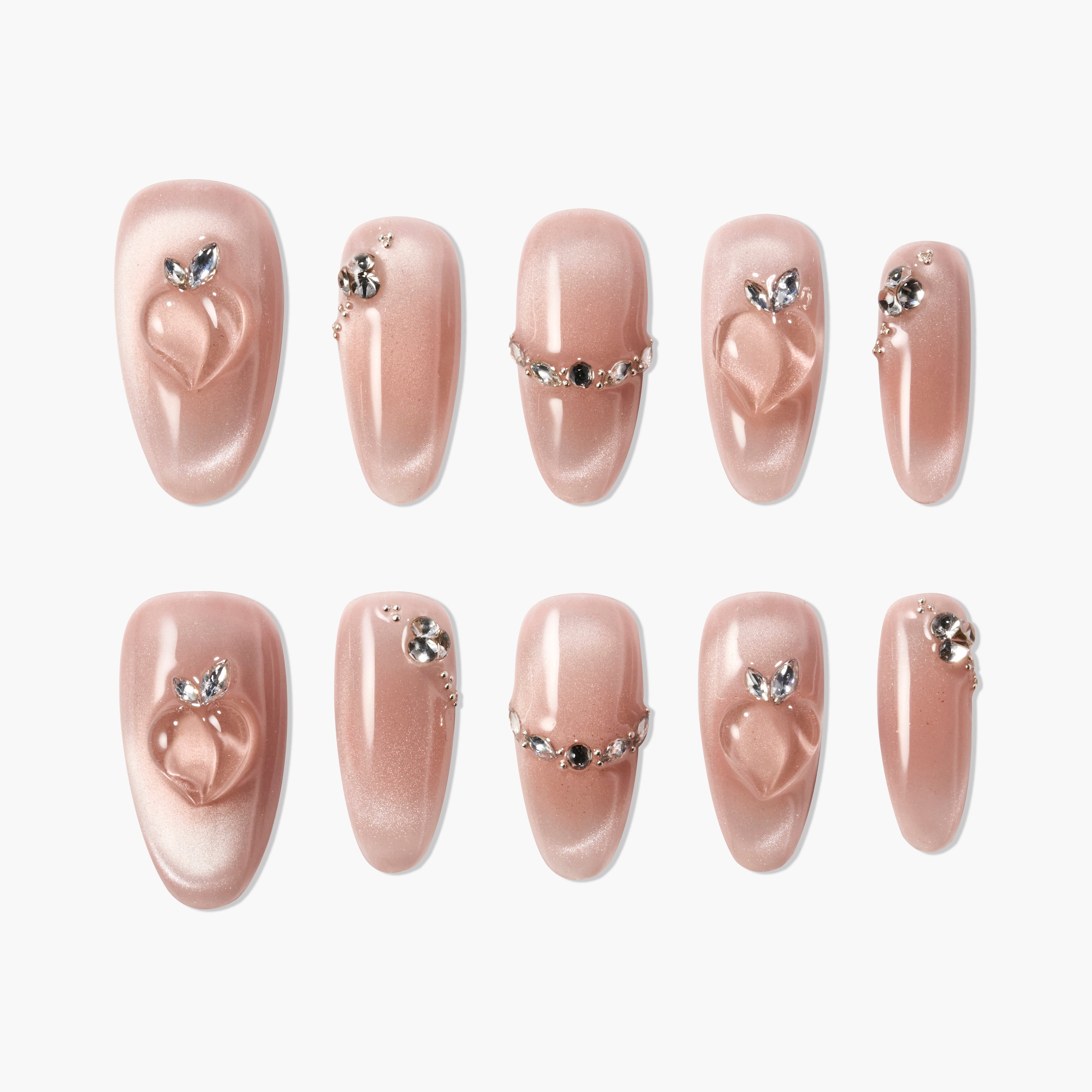 Set of pink glossy press-on nails with 3D heart design and rhinestone embellishments
