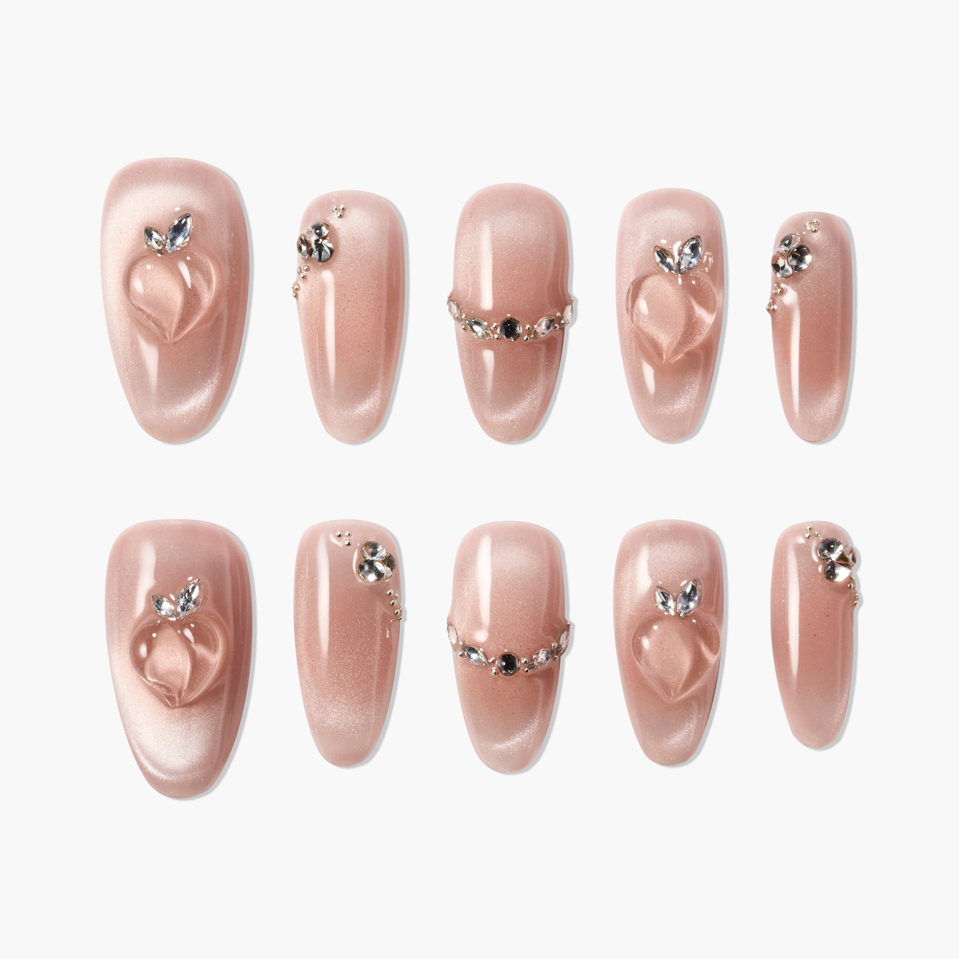 Set of pink glossy press-on nails with 3D heart design and rhinestone embellishments
