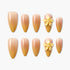 Set of nude ombre press-on nails with yellow 3D flower accents and pearl detail