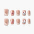 Set of glittery nude fake nails with cupcake and heart designs on white background