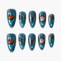 Two sets of blue glittery press-on nails with celestial and heart designs on white background