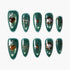 Set of green glittery press-on nails with gold and black celestial and heart designs