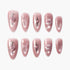 Set of pink glossy press-on nails with glitter heart, cross, star, and swirl designs