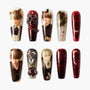 Set of 10 decorative press-on nails featuring anime-style male characters and red black gothic designs with gems