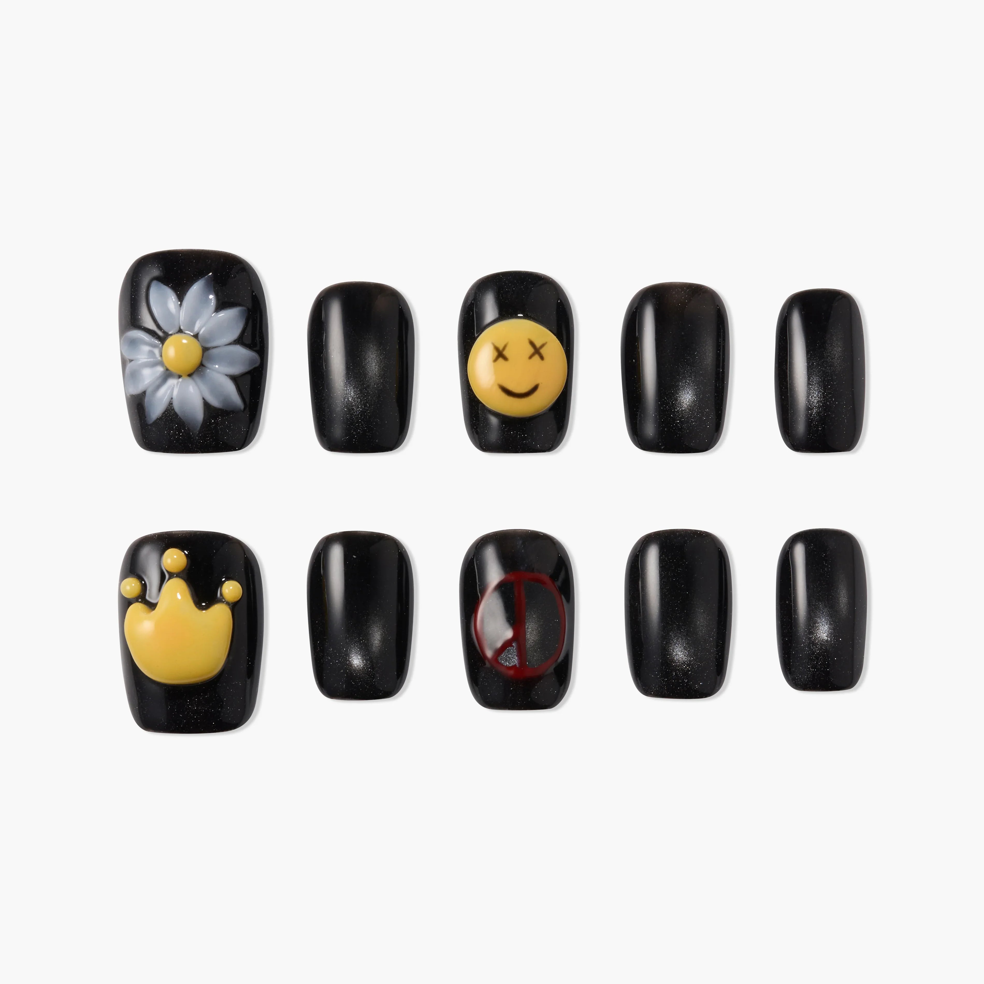 Handmade black press-on nails with daisy, crown, smiley face, and peace sign designs
