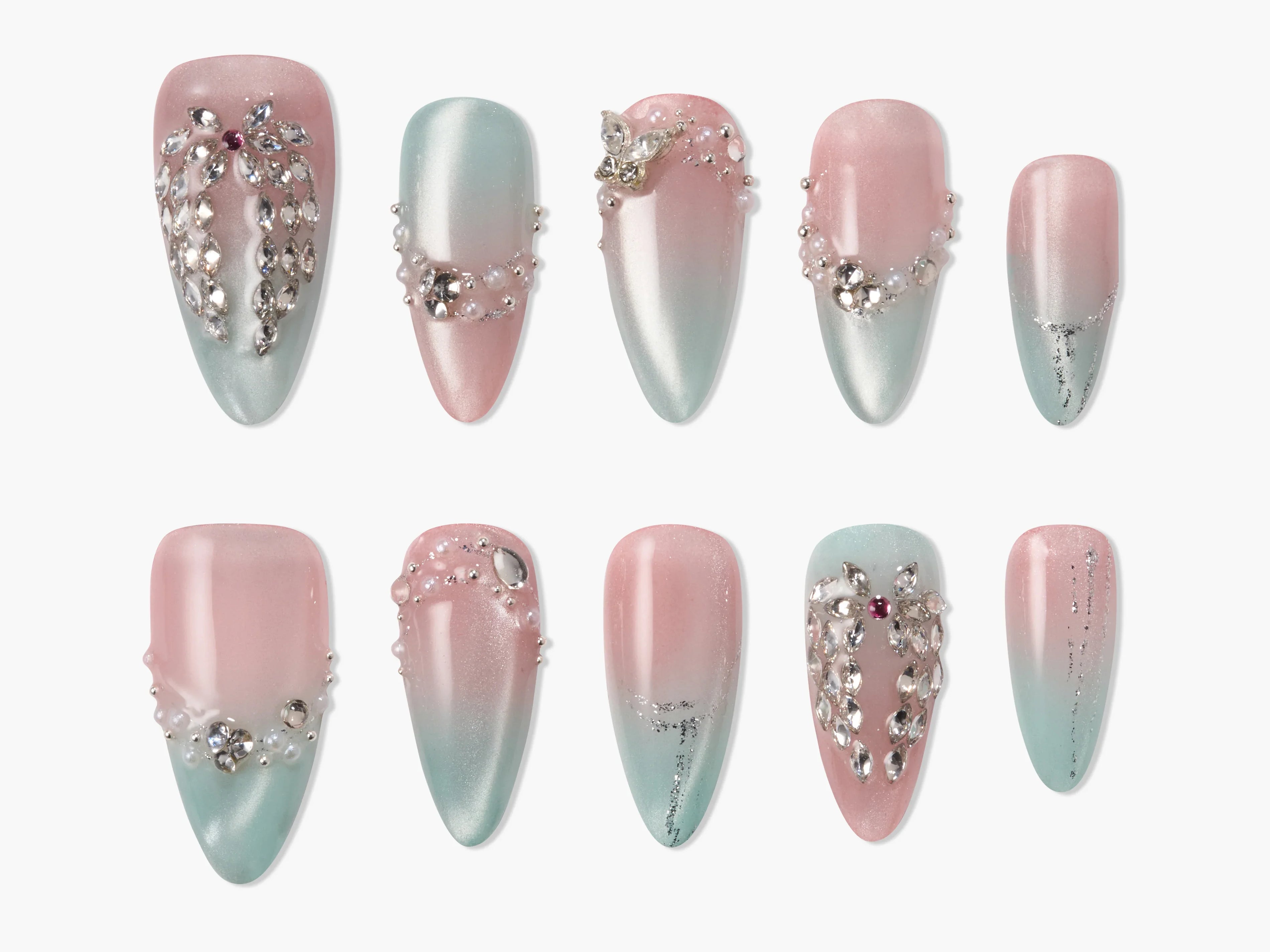 Pink and blue ombre press-on nails with rhinestones and pearl accents, elegant nail art design