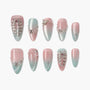 Pink and blue ombre press-on nails with rhinestones and pearl accents, elegant nail art design