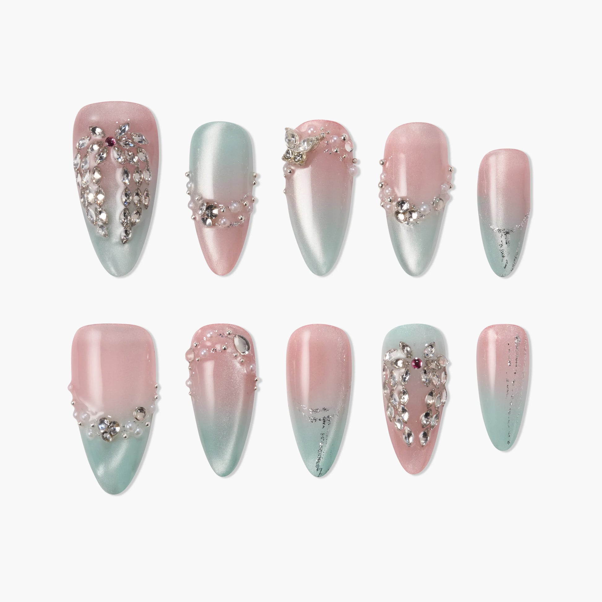 Pink and blue ombre press-on nails with rhinestones and pearl accents, elegant nail art design