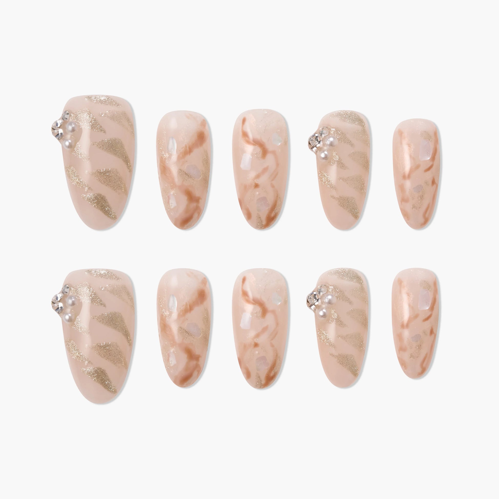 Handmade press-on nails with nude and gold marble design, glitter accents, and pearl rhinestones