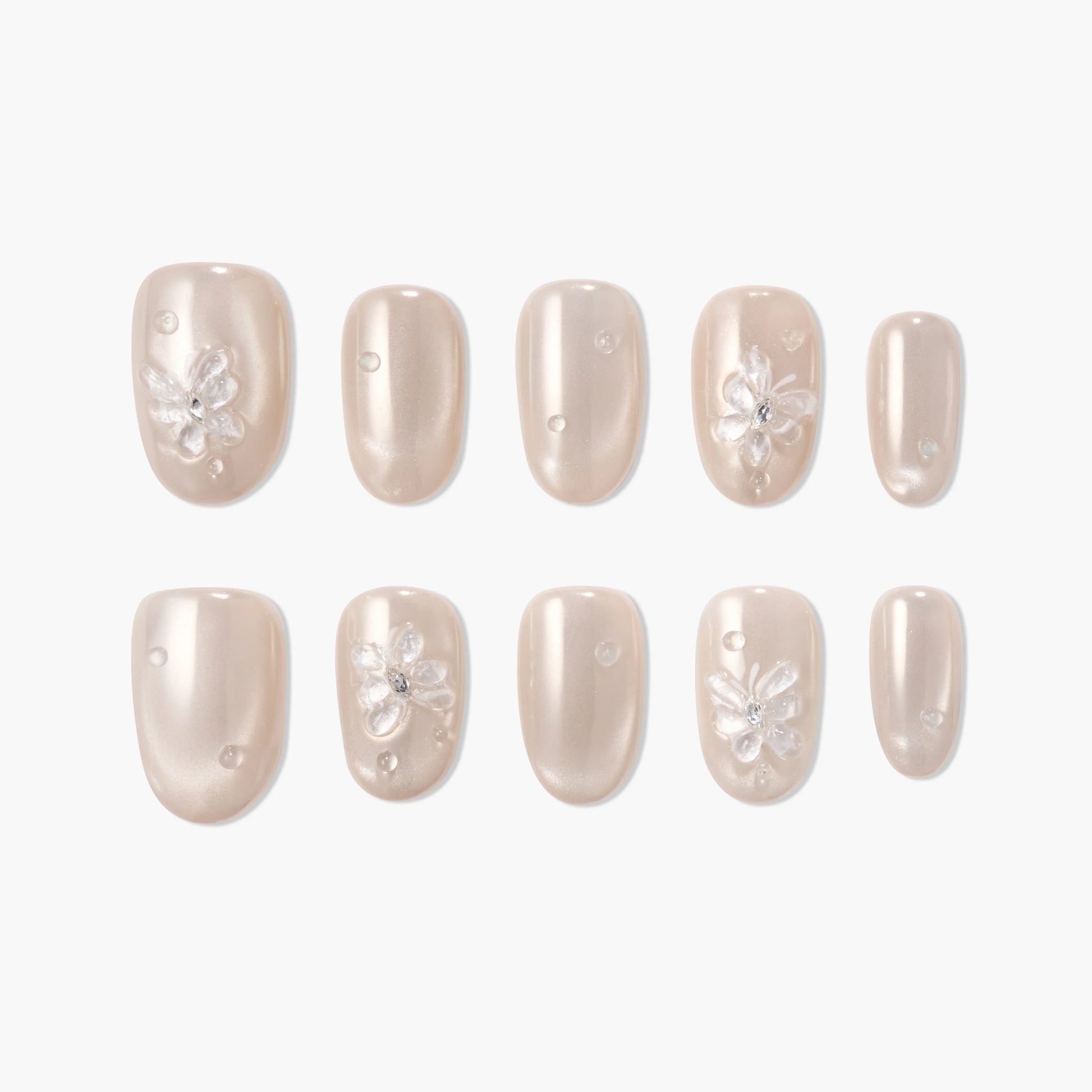 Pearl beige press-on nails with 3D floral accents and crystal embellishments, glossy finish