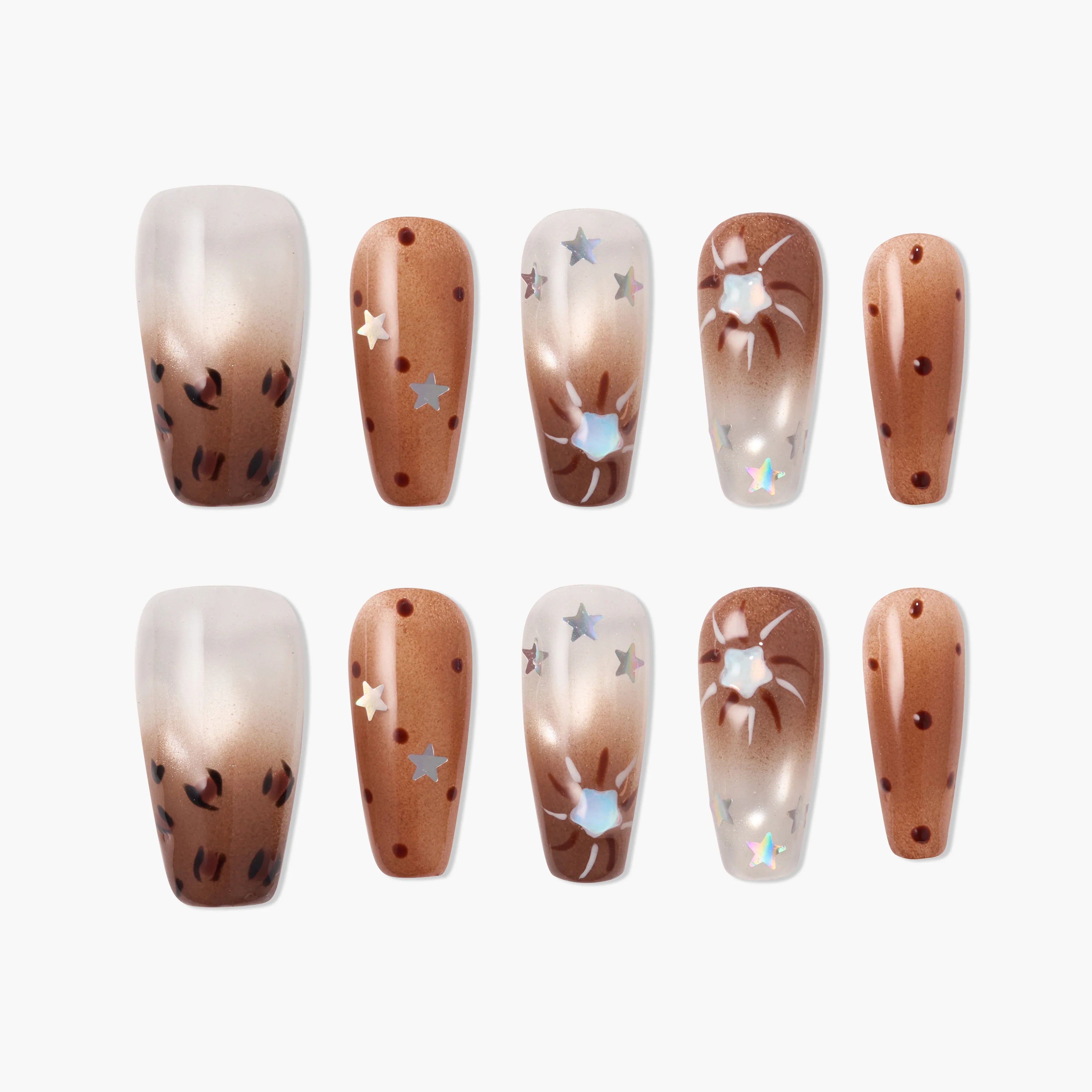 Handmade press-on nails with brown ombré, star accents, and abstract designs.