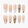 Handmade press-on nails in nude, white, gold, and marble designs with 3D accents