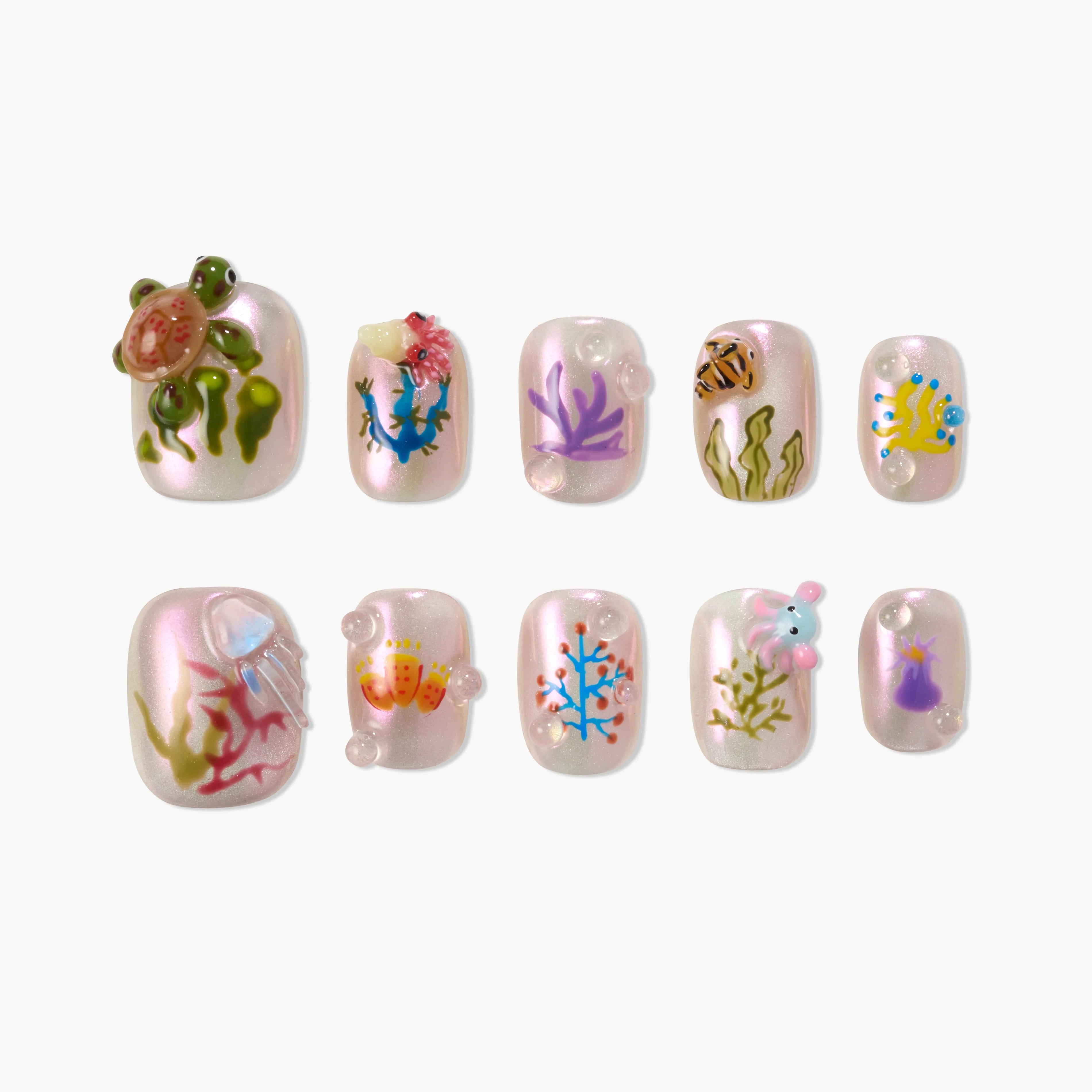 Handmade press-on nails with ocean animals, coral, and pearls on iridescent pink base