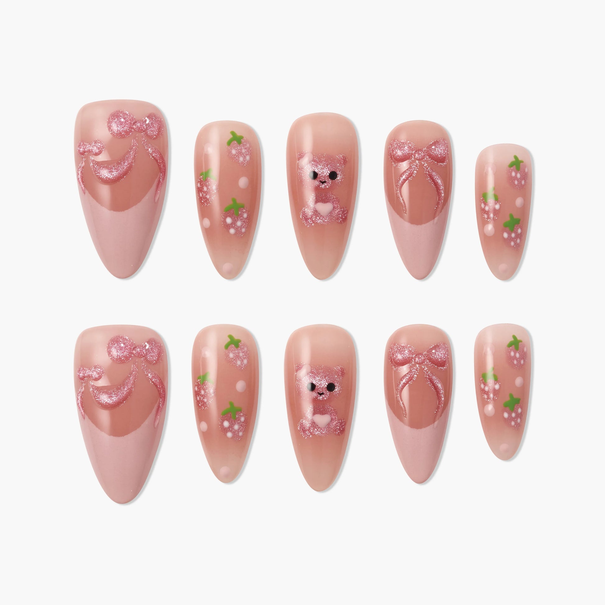Pink press-on nails with glitter bows, bear, and strawberry designs, handmade nail art set