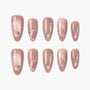 Handmade pink press-on nails with pearl finish, butterfly accents, and subtle heart designs.