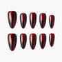 Glossy burgundy and black ombre press-on nails set on white background