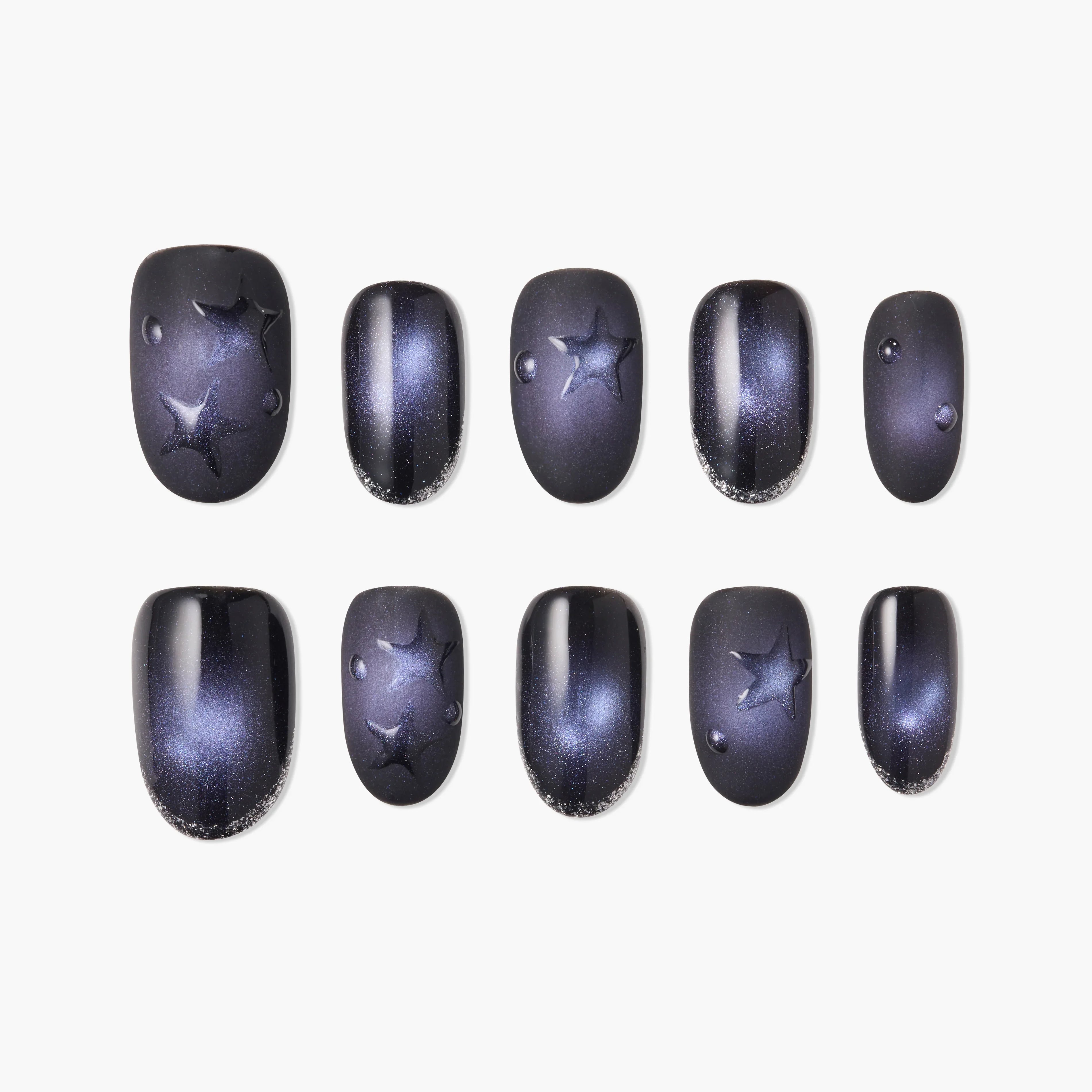 Handcrafted press-on nails with dark galaxy design, star accents, and glossy finish