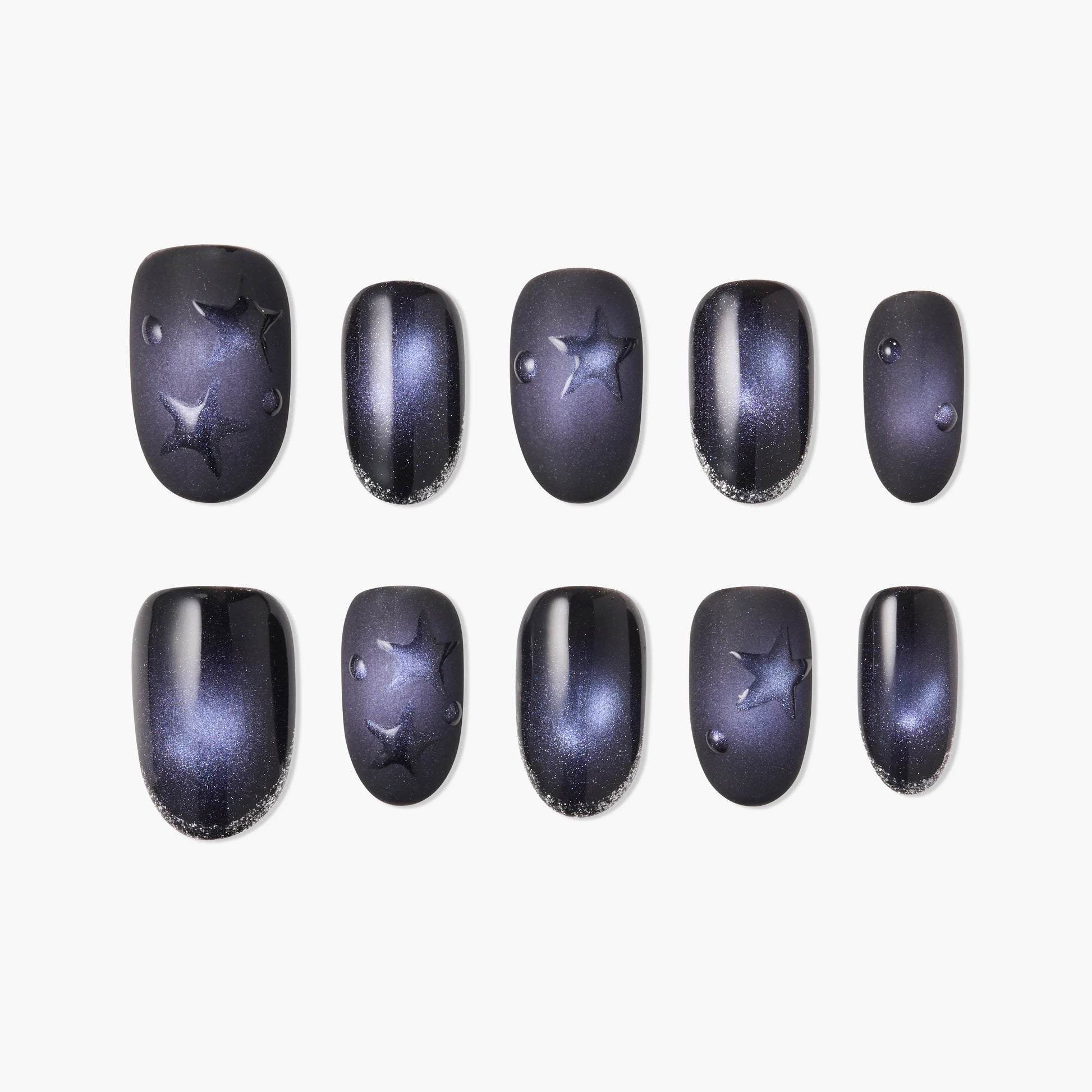 Handcrafted press-on nails with dark galaxy design, star accents, and glossy finish