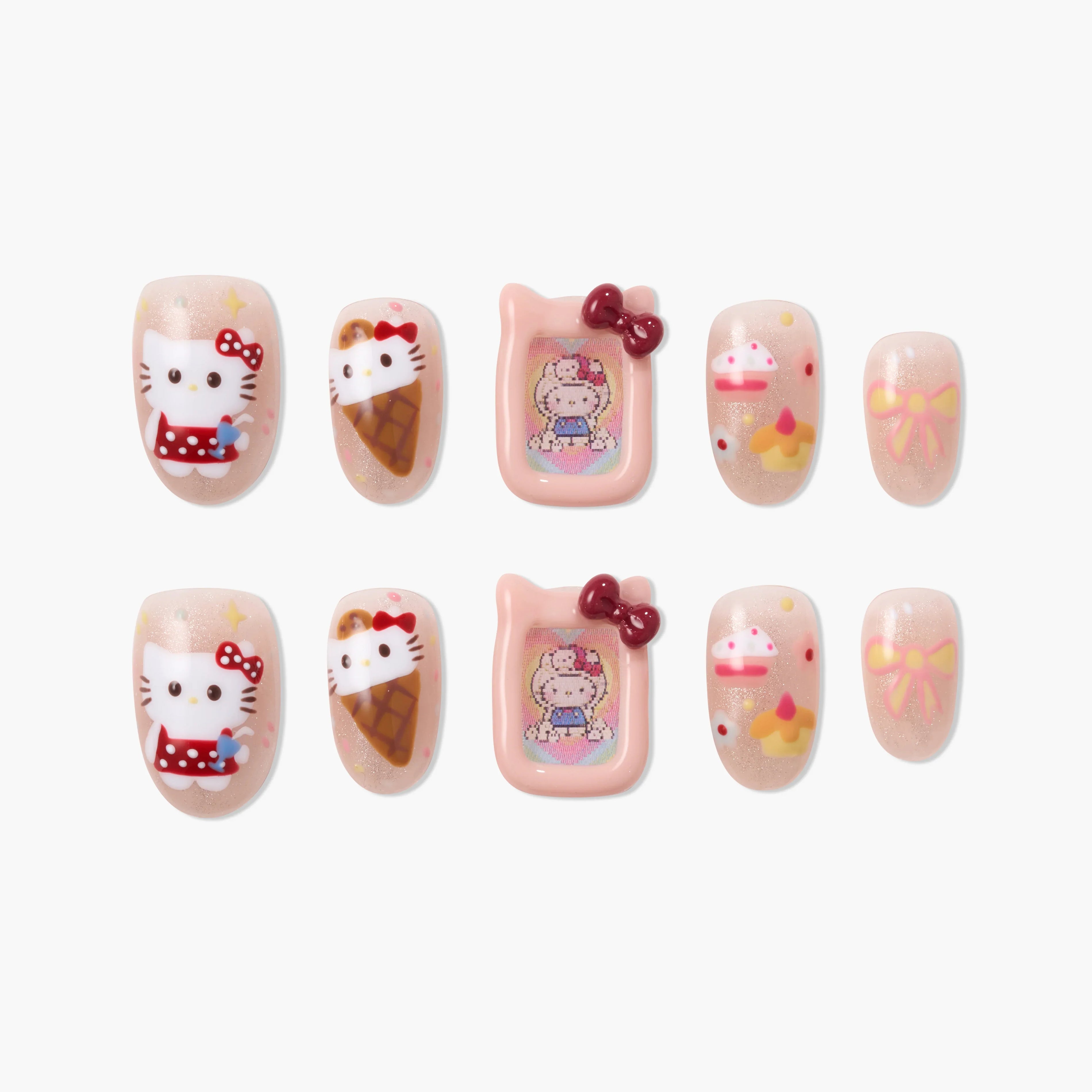 Handmade press-on nails with cartoon cat, ice cream, bow, and pastel cake designs on nude base.