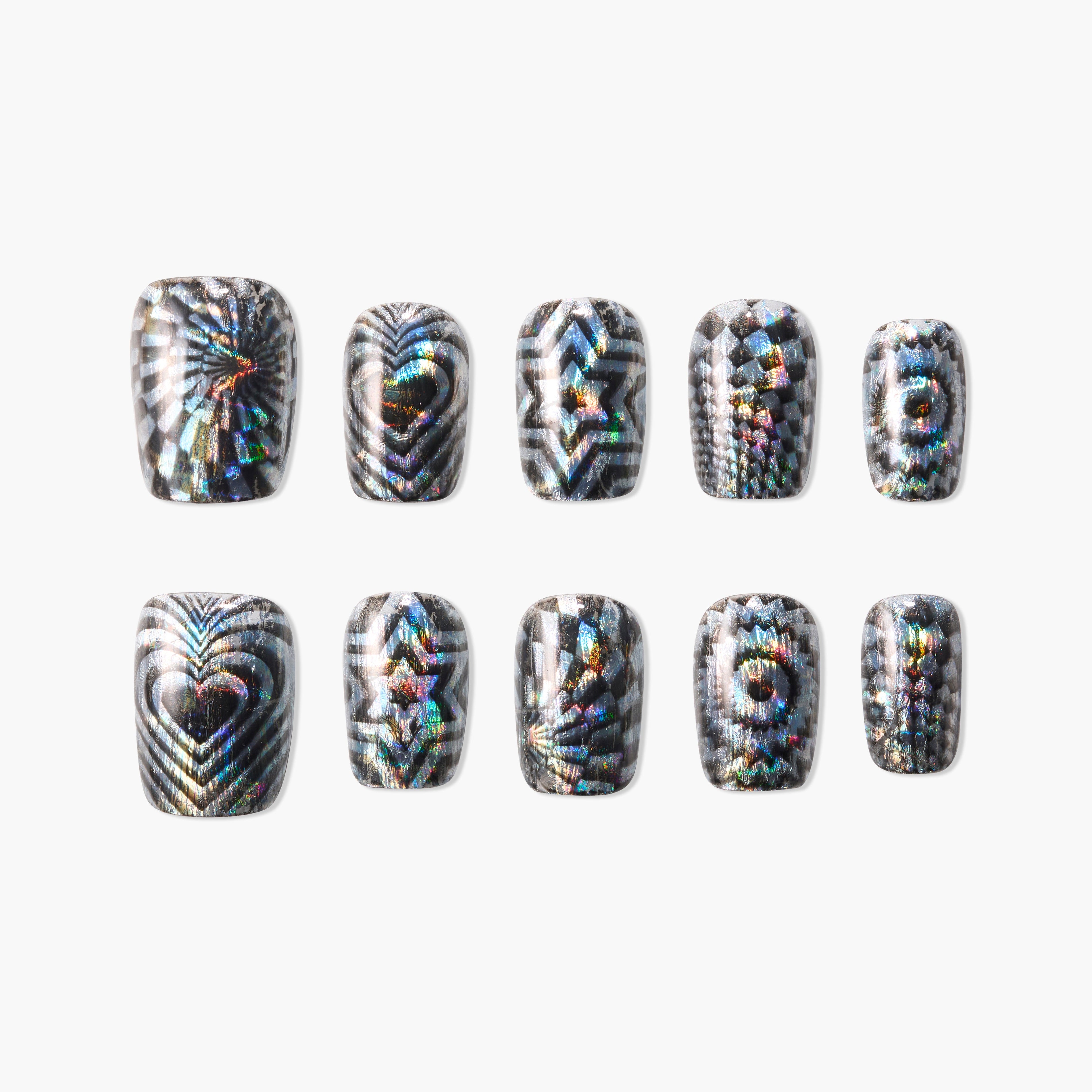 Set of holographic press-on nails with black and white geometric patterns including hearts, stars, and spirals