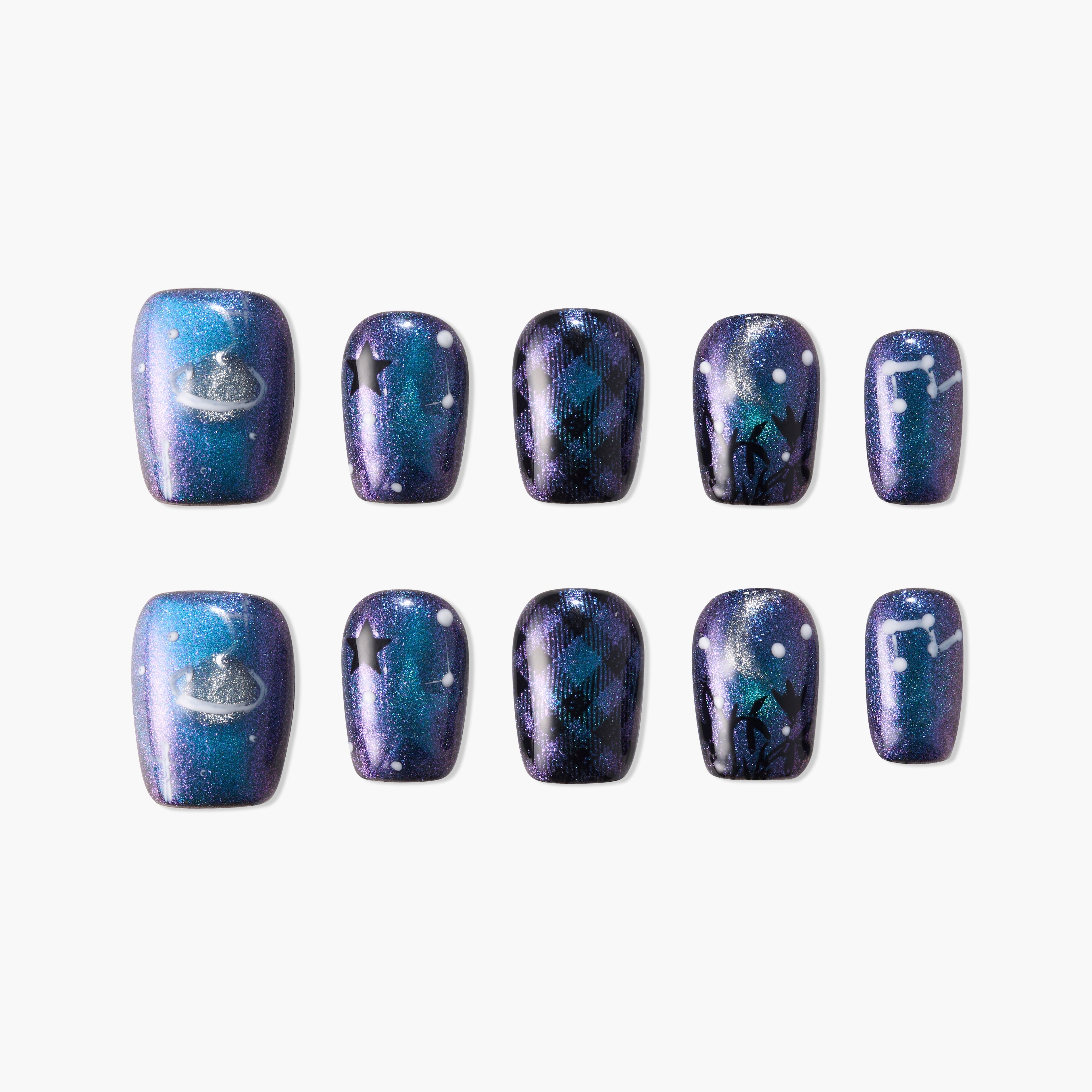 Set of glittery galaxy-themed press-on nails with blue, purple shades and constellation designs