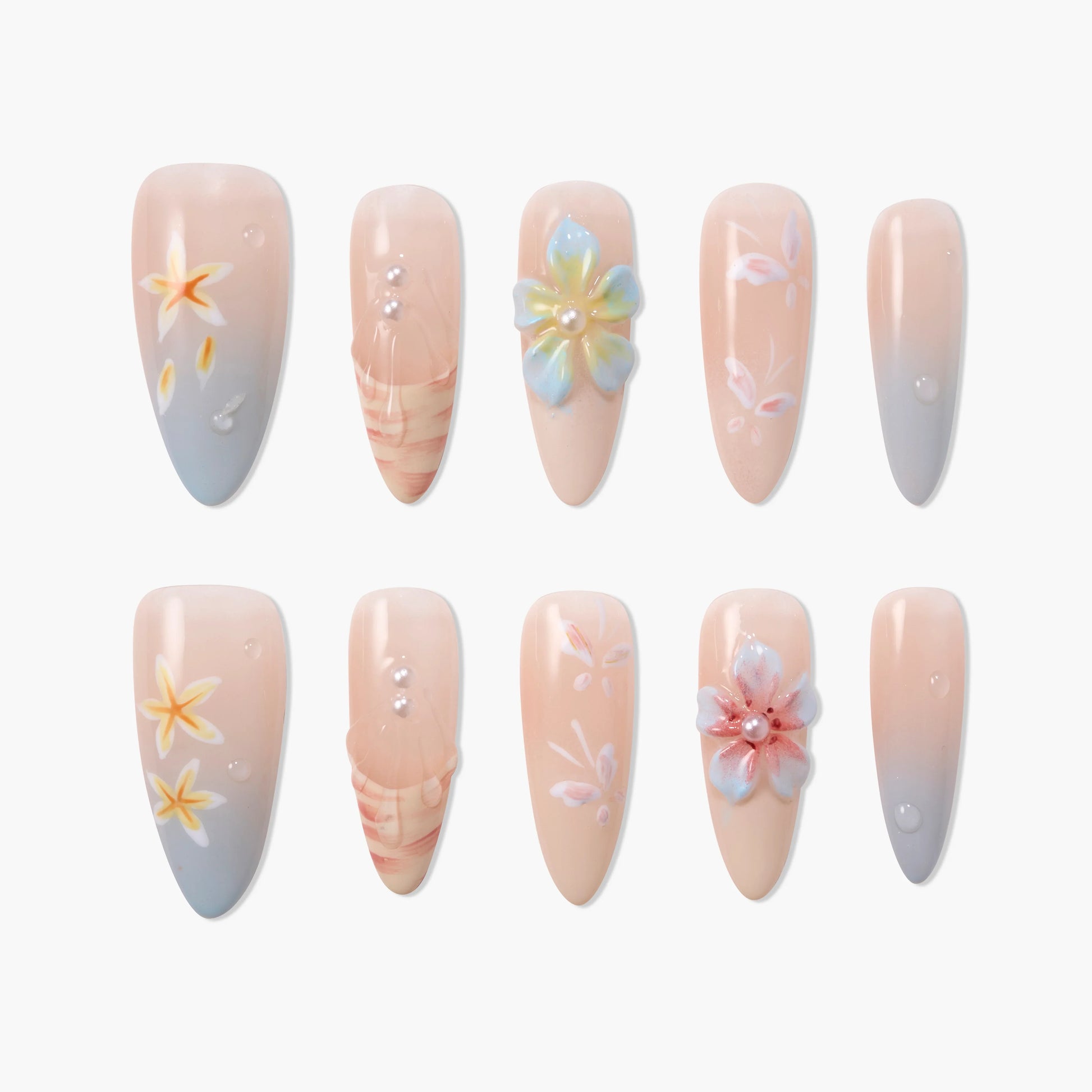 Set of 10 nude and pastel ombre press-on nails with floral designs and pearl accents