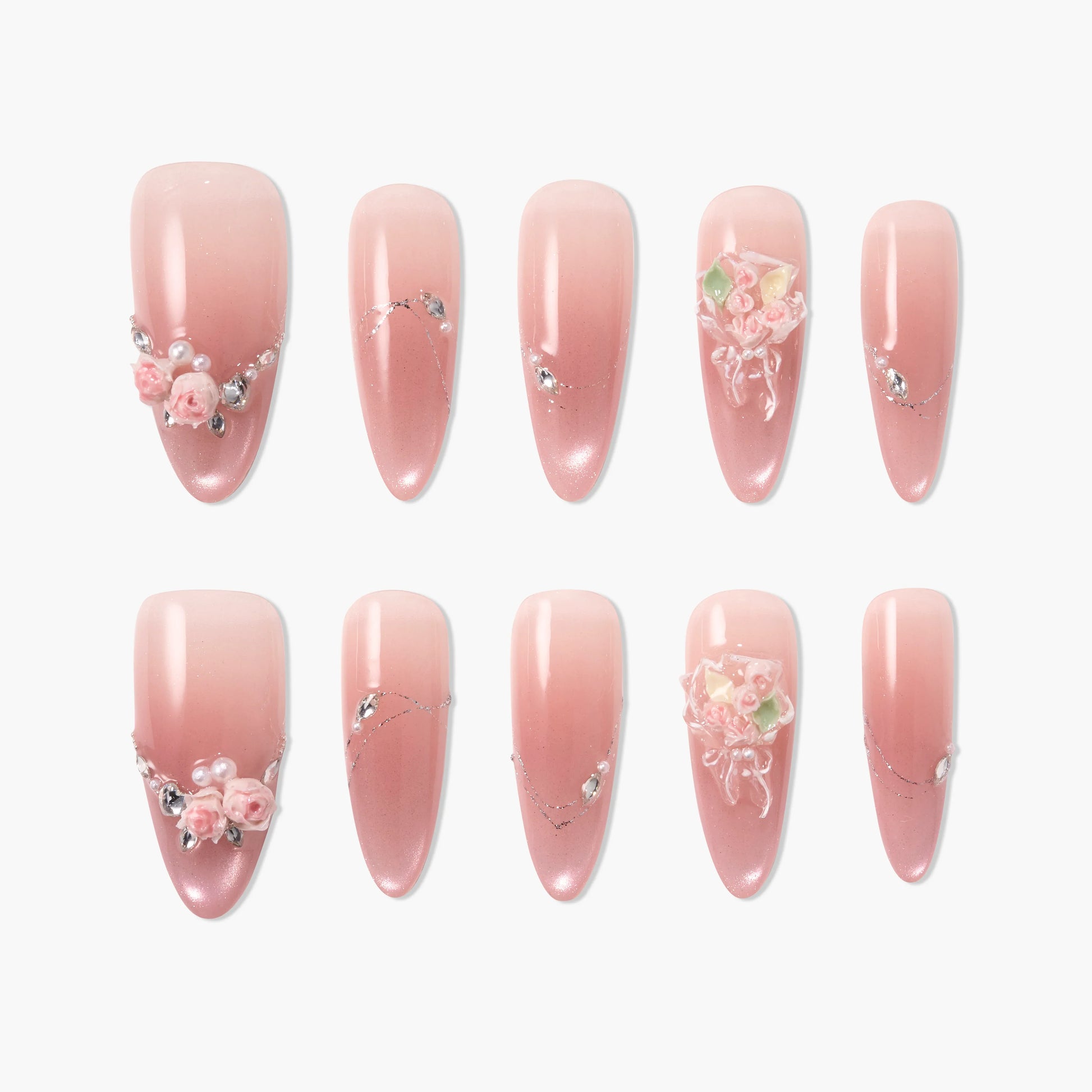 Set of pink ombre press-on nails with 3D floral accents, rhinestones, and pearl details