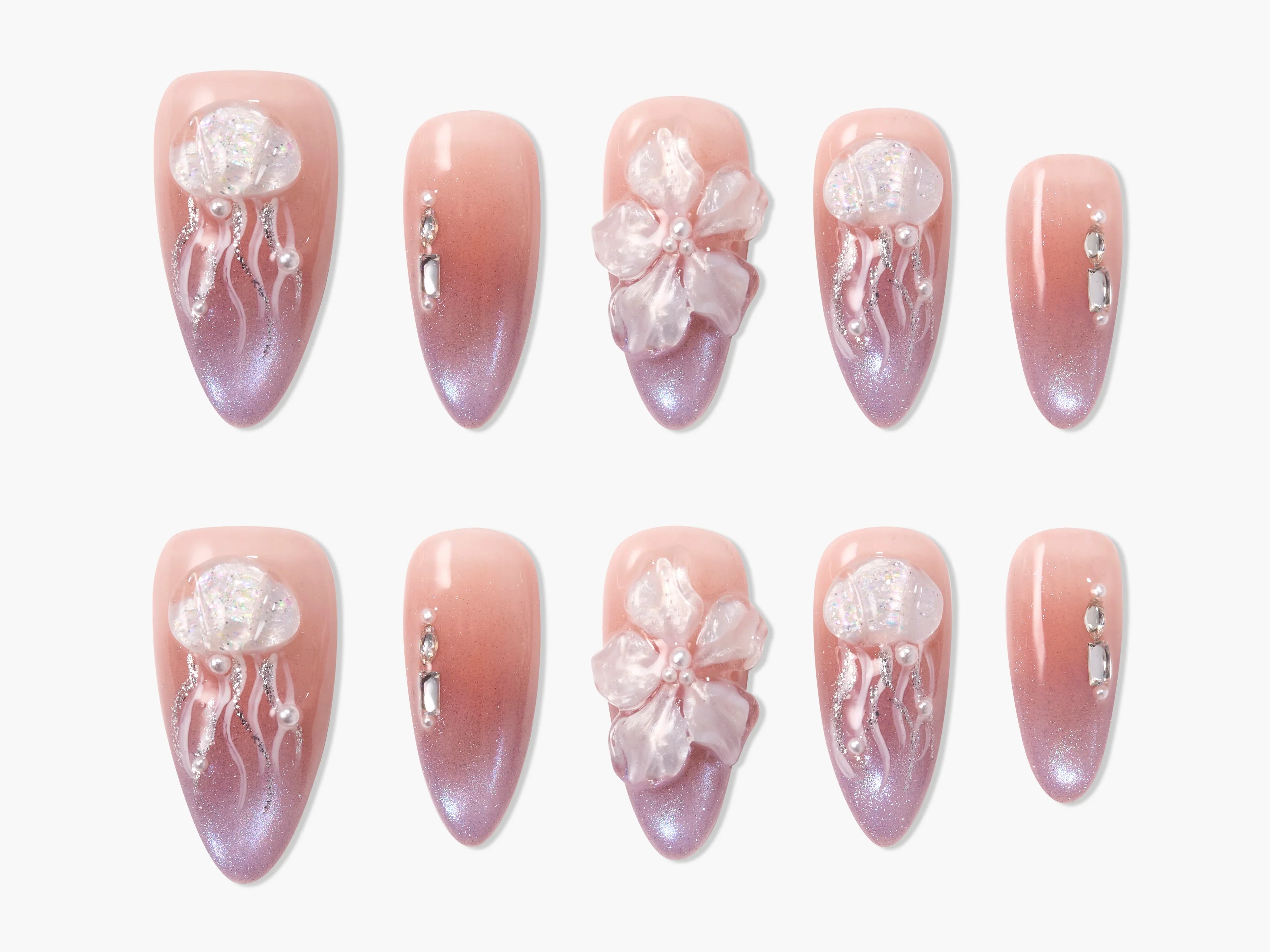 Set of pink ombre press-on nails with 3D jellyfish and flower designs, decorated with pearls and rhinestones