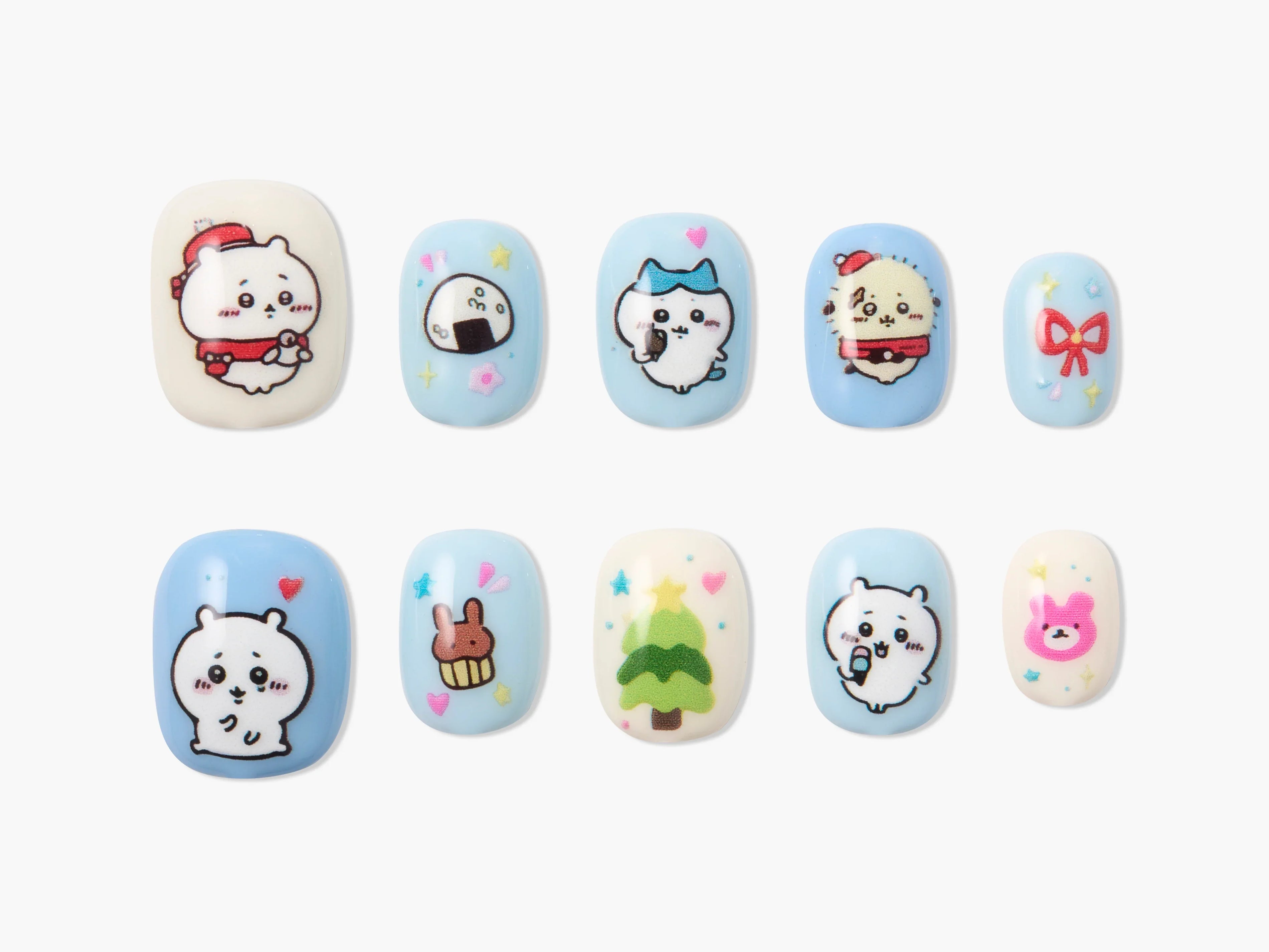 Handmade press-on nails with cute cartoon designs, pastel blue and white, holiday themed