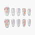 Set of glittery silver press-on nails with pink floral and green leaf designs