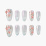 Set of glittery silver press-on nails with pink floral and green leaf designs