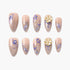 Set of beige press-on nails with intricate purple floral designs and pearl accents