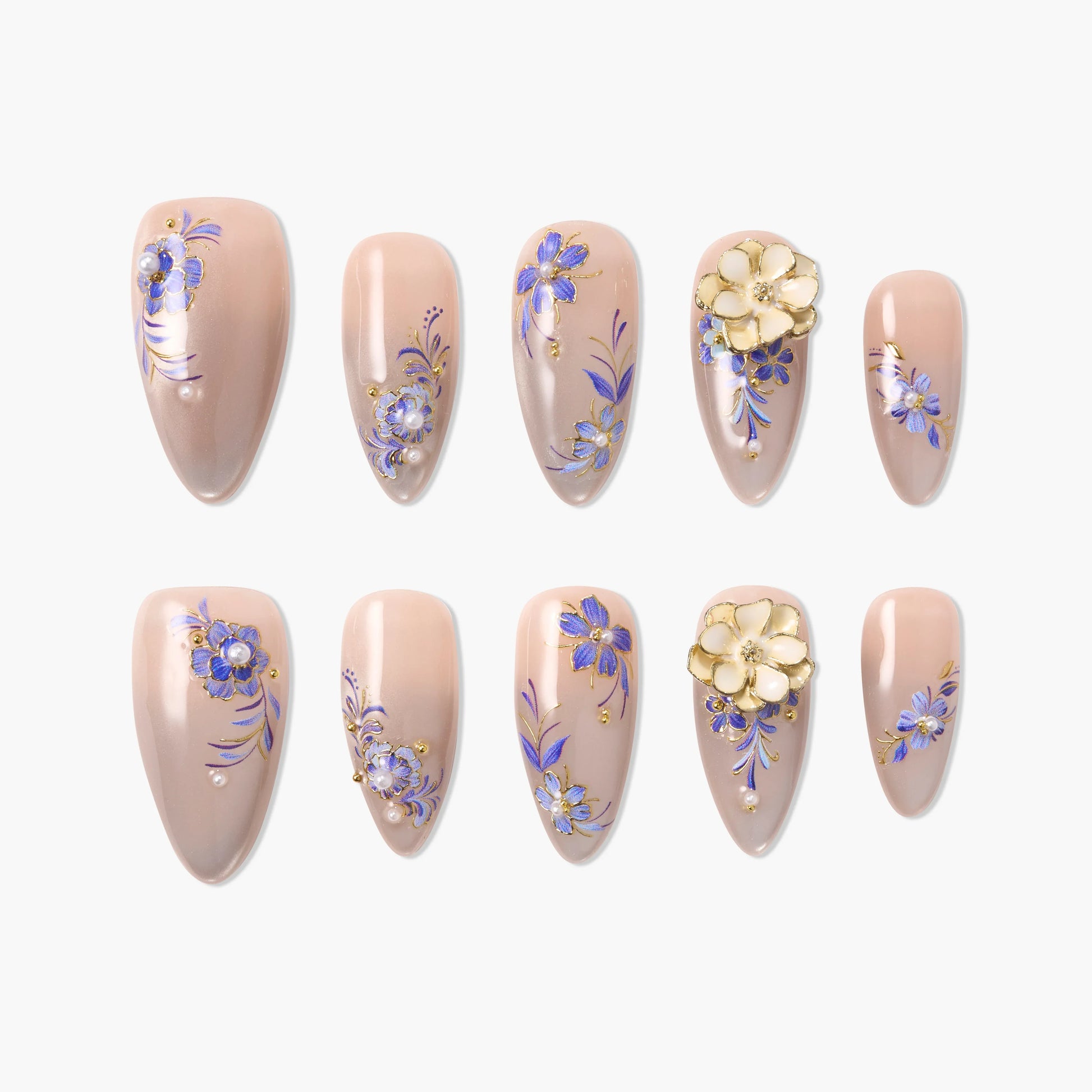 Set of beige press-on nails with intricate purple floral designs and pearl accents