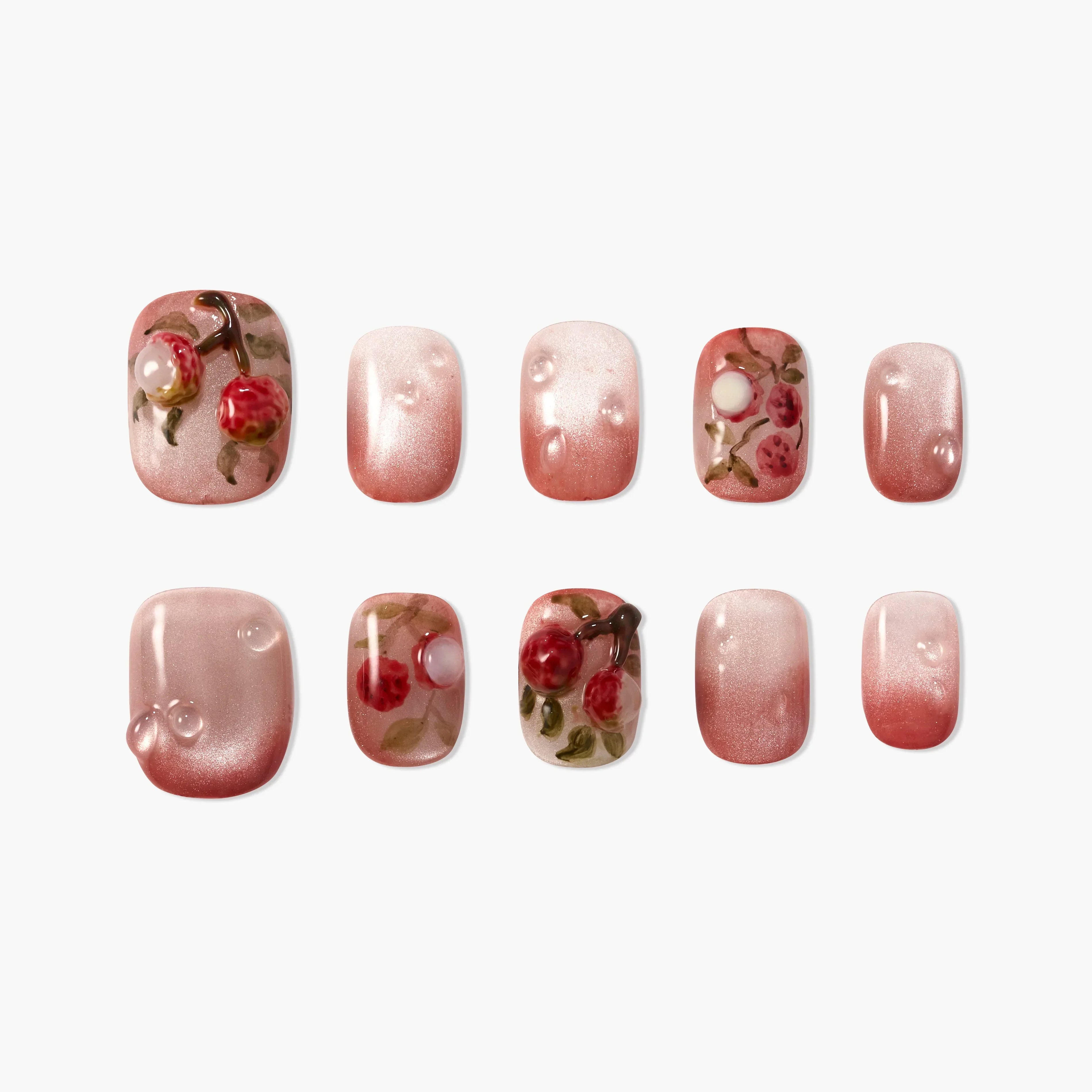 Set of pink press-on nails with 3D cherry and leaf designs and glossy finish