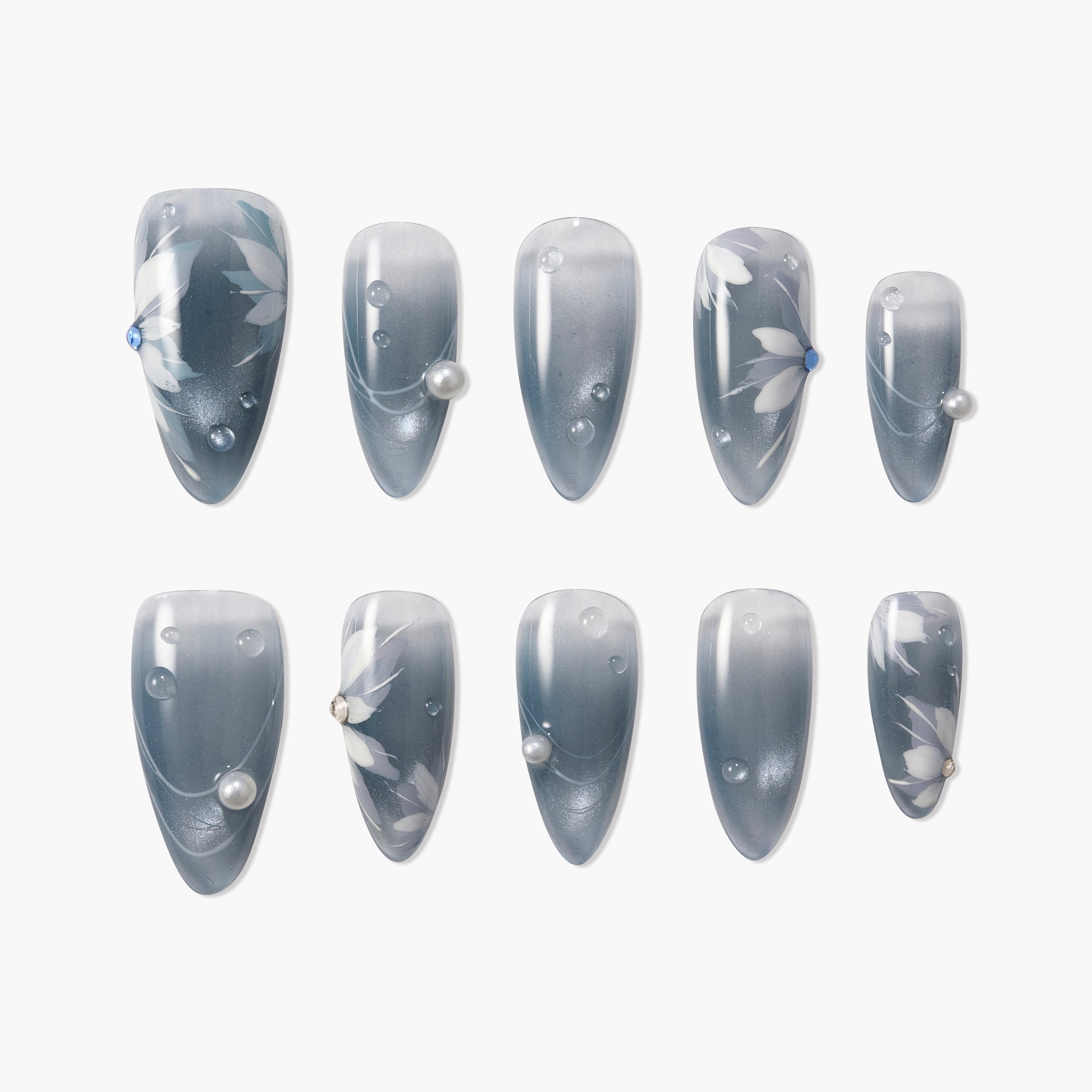 Set of 10 gray ombré press-on nails with white floral designs and pearl and blue rhinestone accents