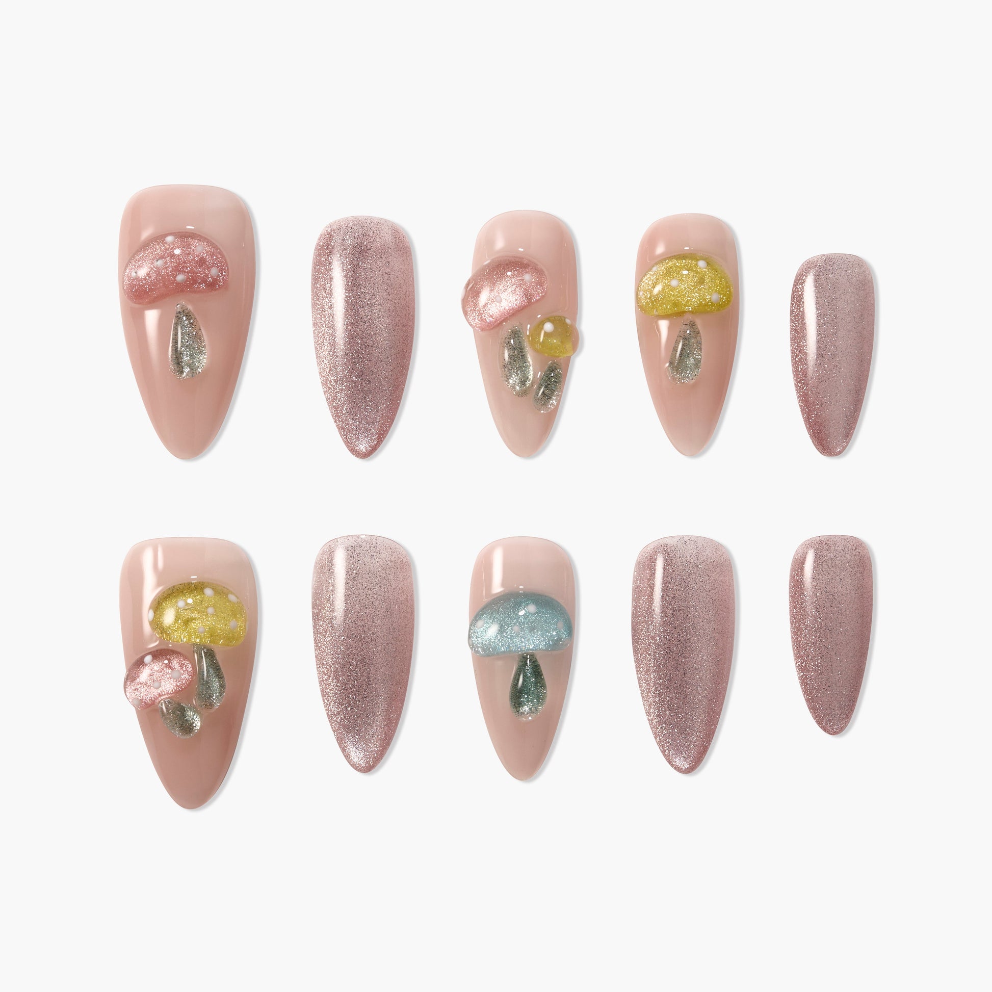 Handmade press-on nails with nude base, glitter accents, and 3D mushroom designs.