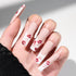 Long matte nude press-on nails with red and pink lip print designs on white tips